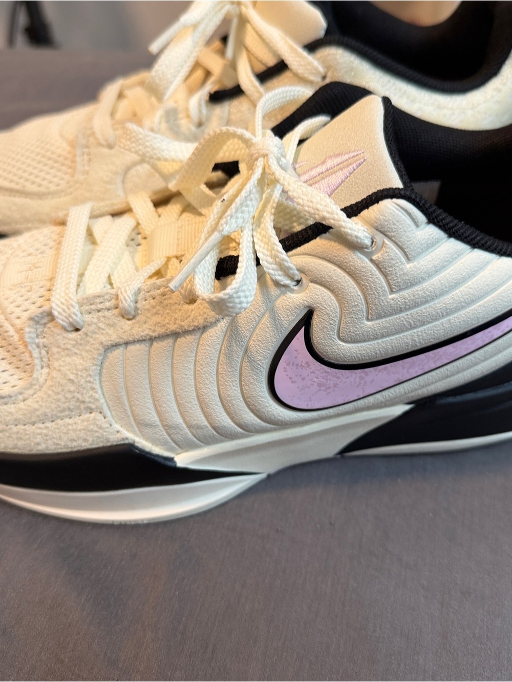 Nike Cream Sneakers with Lilac Swoosh and Black Accents